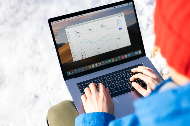 A creator reviewing past post performance in an analytics dashboard, identifying strong candidates for repurposing