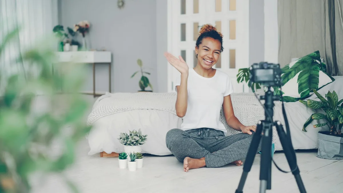 Solo creator filming a video in a home studio setup